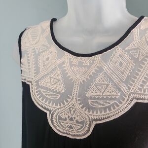 Sleeveless Black Top with Cream Detailing